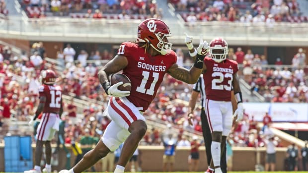Sep 4, 2021; Norman, Oklahoma, USA; Oklahoma Sooners linebacker Nik Bonitto (11) recovers a fumble during the second quarter against the Tulane Green Wave at Gaylord Family-Oklahoma Memorial Stadium. Mandatory Credit: Kevin Jairaj-USA TODAY Sports